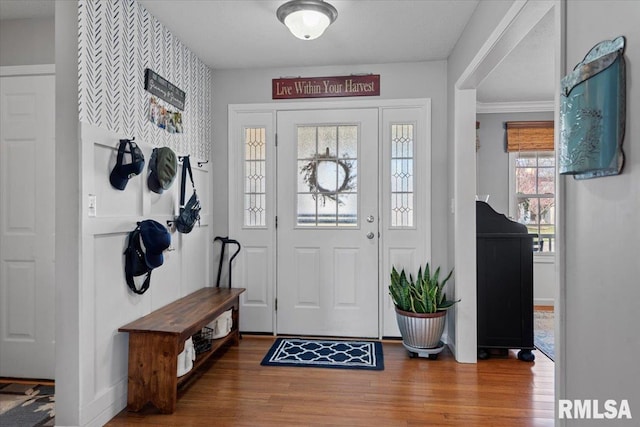 foyer featuring wood finished floors