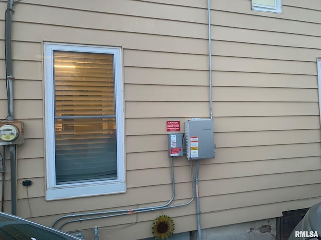 exterior details featuring electric meter