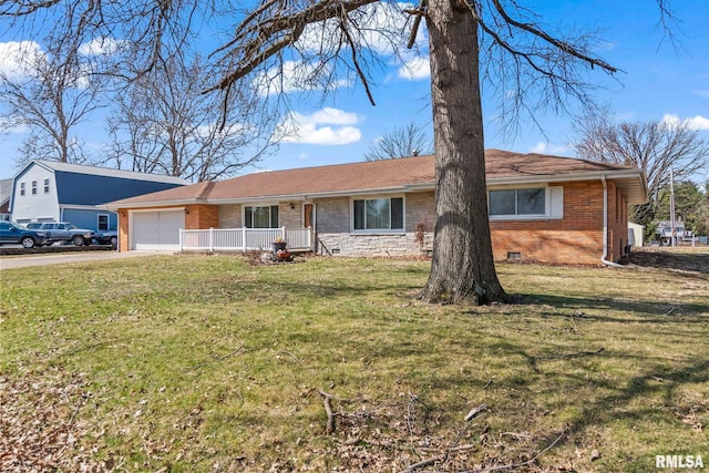 single story home with a garage, driveway, a front yard, crawl space, and brick siding