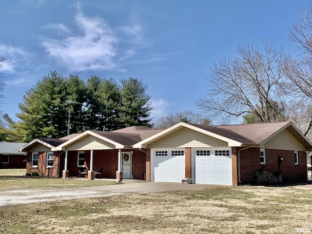 ranch-style home with brick siding, a front lawn, concrete driveway, and a garage