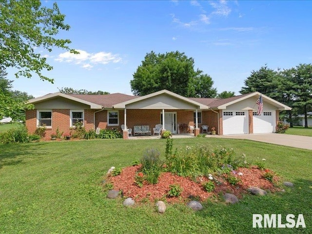 single story home with a porch, concrete driveway, an attached garage, a front yard, and brick siding