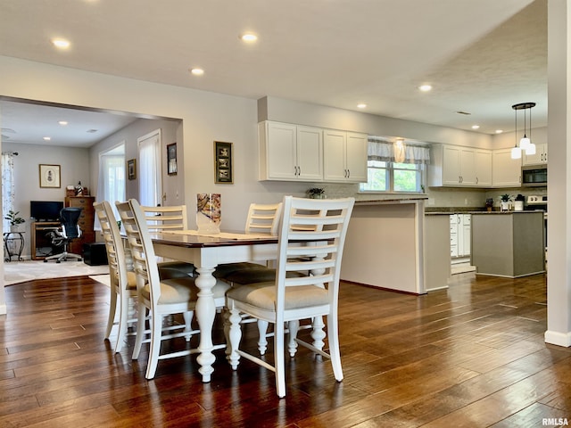 dining space with recessed lighting and dark wood-style flooring