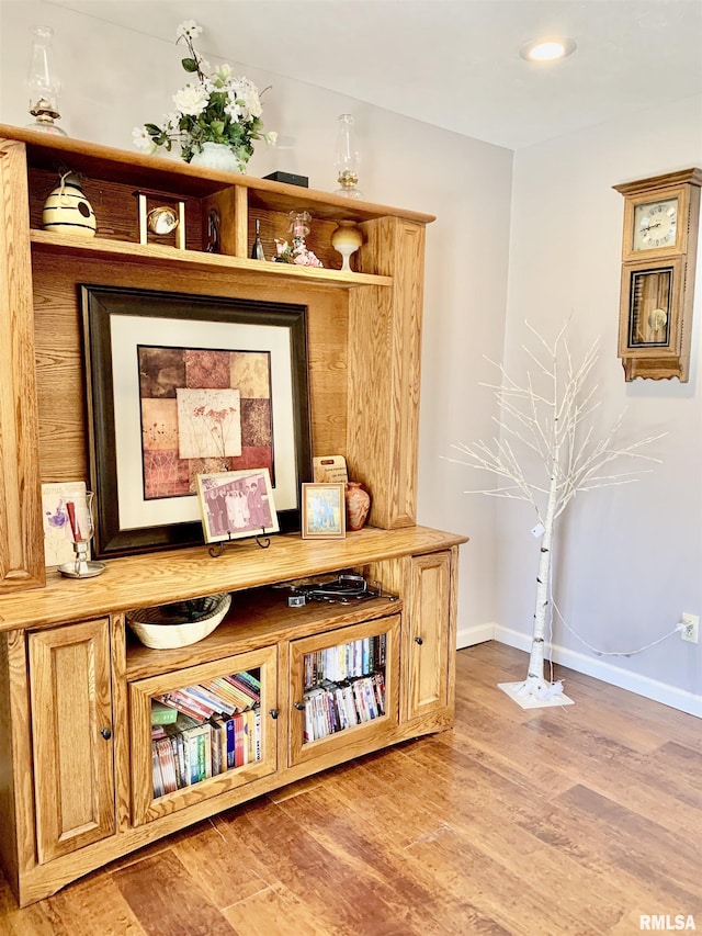 interior space featuring recessed lighting, light wood-type flooring, and baseboards