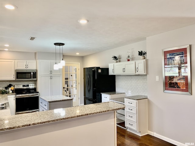 kitchen featuring light stone counters, backsplash, dark wood-style floors, appliances with stainless steel finishes, and white cabinets