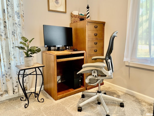 carpeted office with baseboards