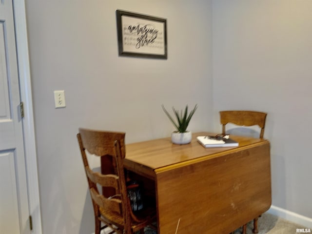 dining area featuring baseboards