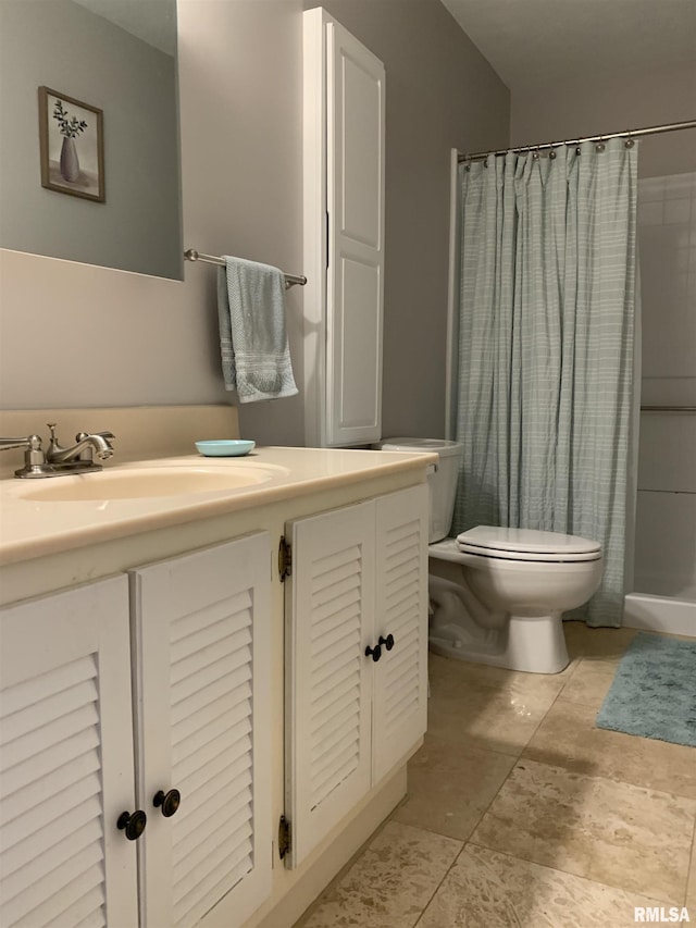 bathroom with tile patterned floors, toilet, vanity, and a shower with curtain