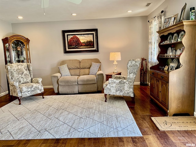 living area with recessed lighting, visible vents, baseboards, and dark wood-type flooring