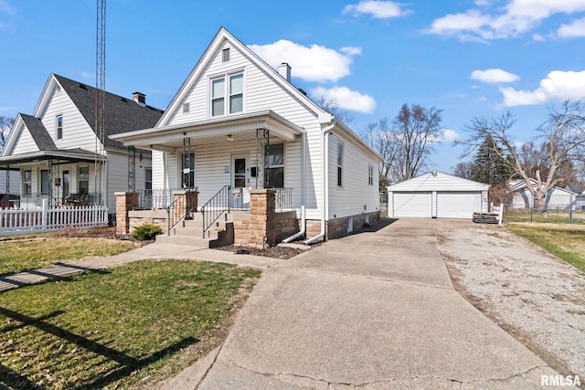 bungalow-style home with an outbuilding, fence, covered porch, and a detached garage