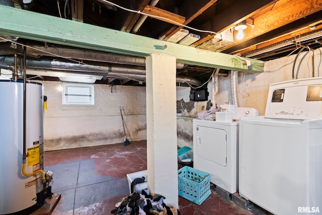 basement featuring gas water heater and washer and dryer