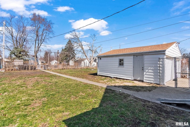 view of yard with an outbuilding and fence