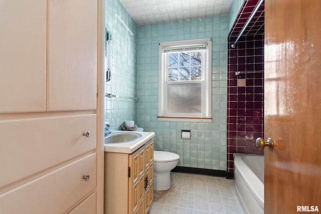 full bathroom featuring toilet, tile walls, and vanity