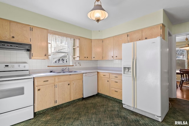 kitchen featuring under cabinet range hood, light brown cabinetry, light countertops, white appliances, and a sink