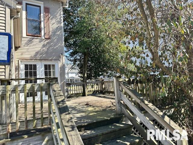 view of side of property with a wooden deck