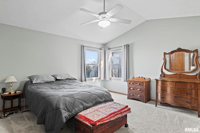 bedroom featuring lofted ceiling, baseboards, carpet floors, and ceiling fan