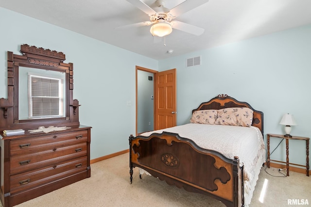 carpeted bedroom with a ceiling fan, baseboards, and visible vents