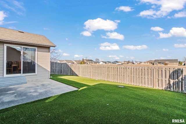 view of yard with a patio area and fence