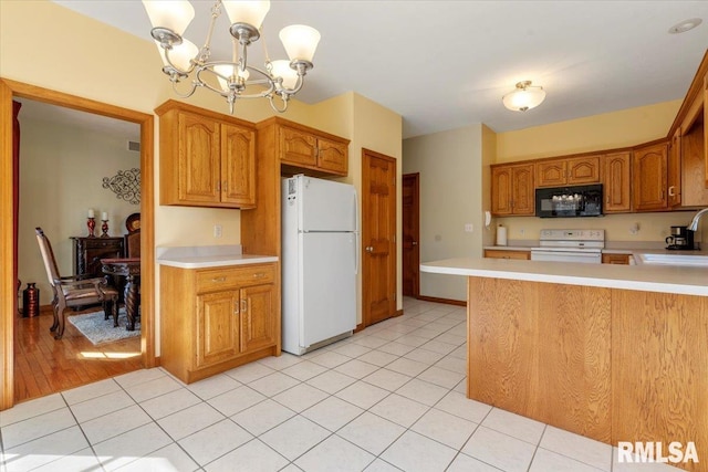 kitchen featuring light tile patterned floors, white appliances, a notable chandelier, and light countertops