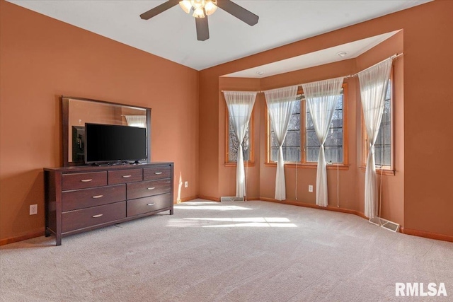 bedroom featuring a ceiling fan, baseboards, visible vents, and carpet floors