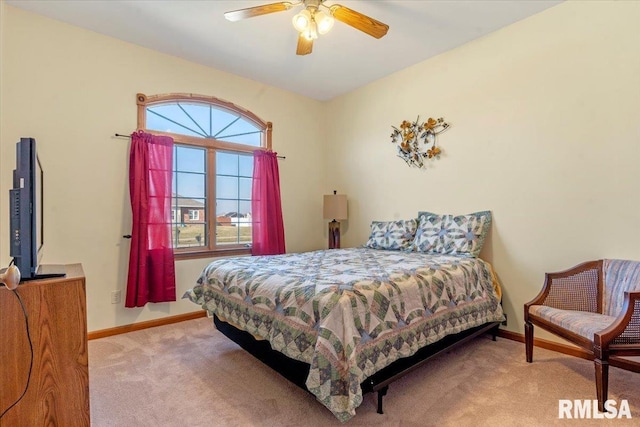 bedroom featuring ceiling fan, baseboards, and carpet