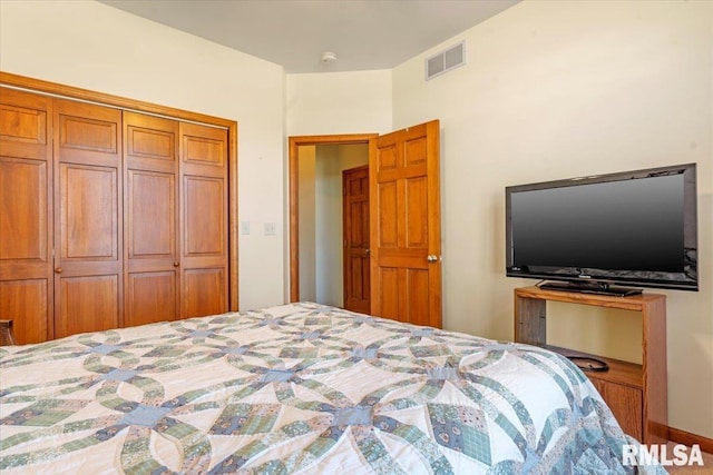 bedroom featuring visible vents and a closet