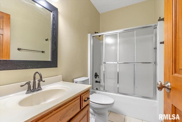 full bath with tile patterned floors, toilet, shower / bath combination with glass door, and vanity