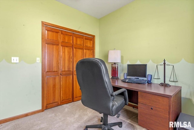 office area with light colored carpet and baseboards