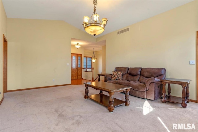 living area featuring carpet, baseboards, visible vents, an inviting chandelier, and vaulted ceiling