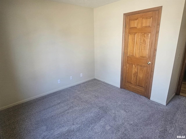 unfurnished bedroom with baseboards and carpet flooring