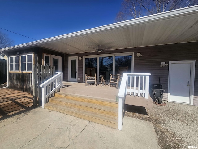 wooden deck with a ceiling fan and covered porch