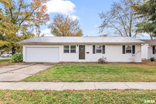 ranch-style home featuring concrete driveway, an attached garage, a front lawn, and metal roof