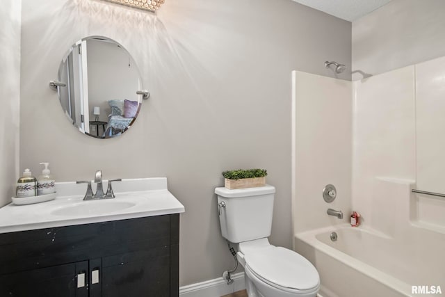 full bathroom with vanity, toilet, baseboards, and shower / bath combination