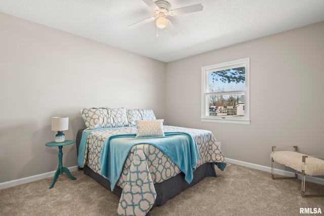 carpeted bedroom featuring a ceiling fan and baseboards