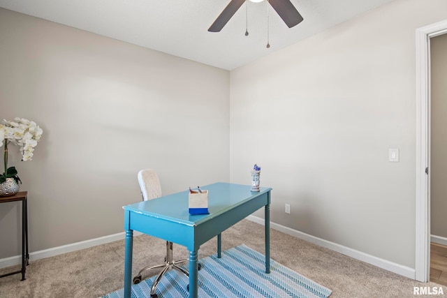 home office featuring baseboards, carpet floors, and ceiling fan