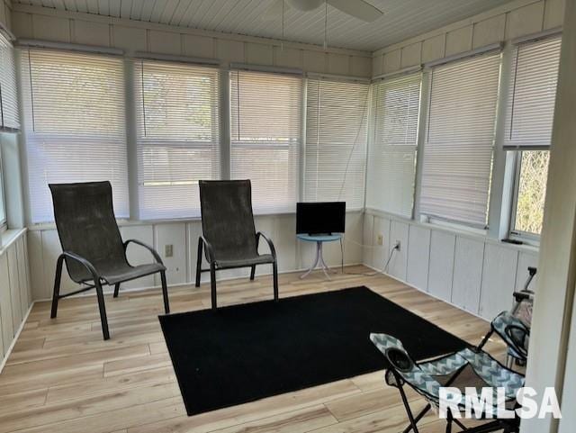 sunroom featuring ceiling fan