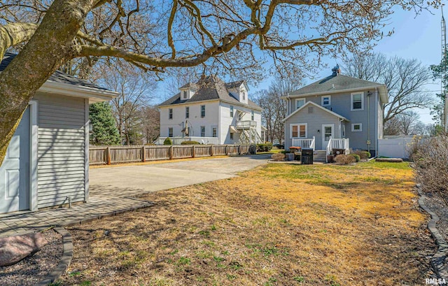 view of yard featuring a patio area and fence