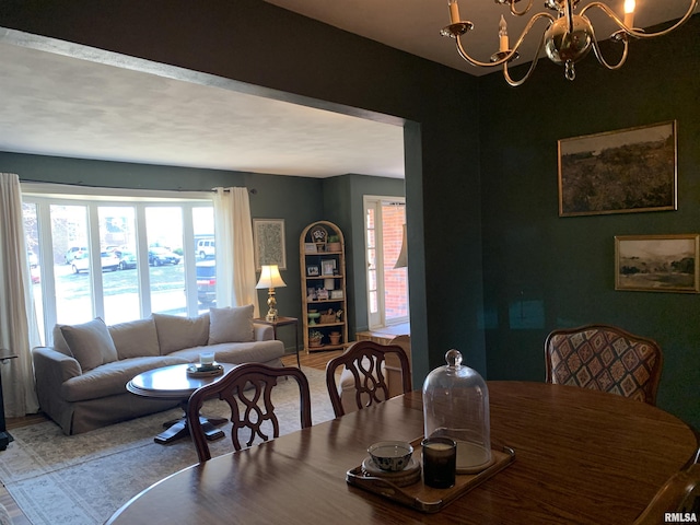 dining area with an inviting chandelier