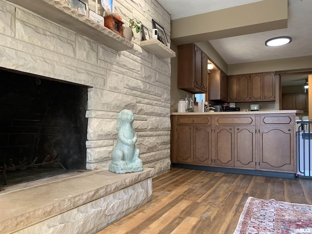 kitchen featuring light countertops and dark wood-style flooring