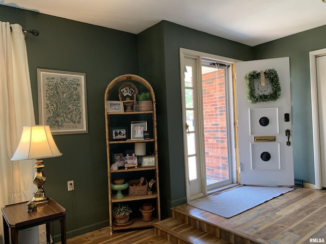 entrance foyer featuring plenty of natural light, wood finished floors, and baseboards