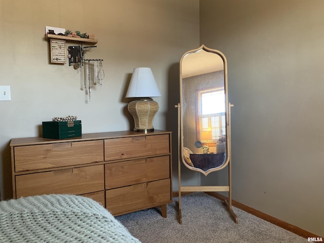 bedroom featuring baseboards and carpet