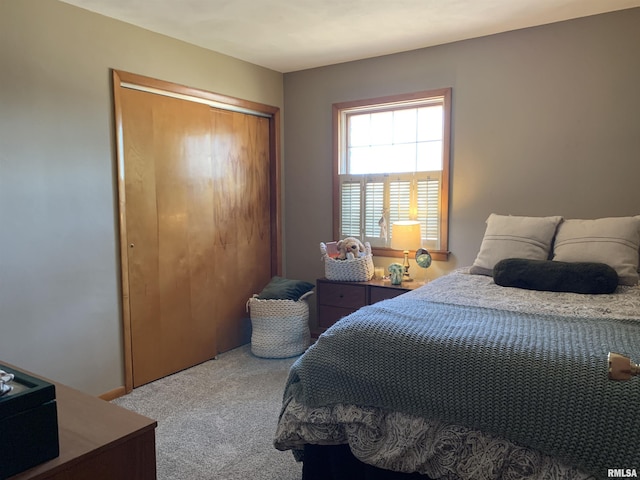 carpeted bedroom featuring a closet