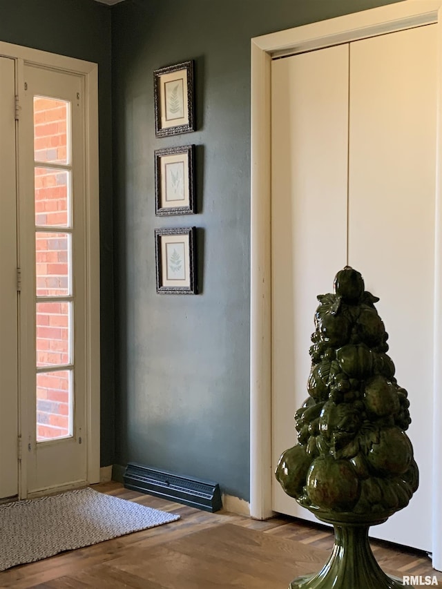 doorway to outside with wood finished floors