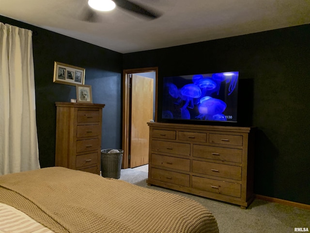 bedroom with baseboards, light carpet, and a ceiling fan