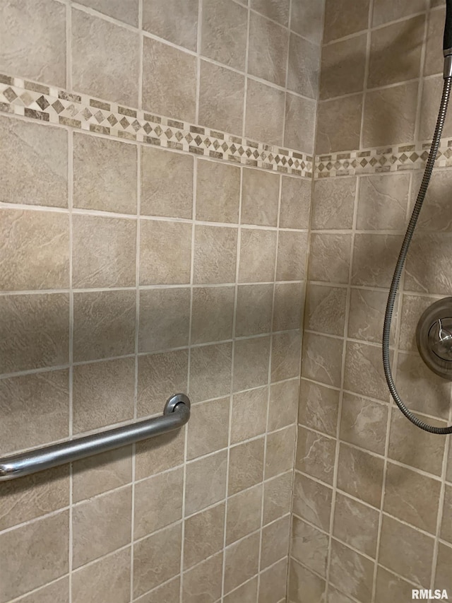 bathroom with tiled shower