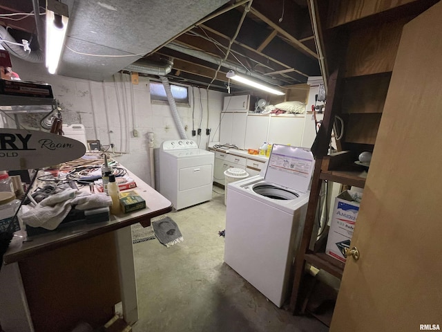 unfinished basement featuring washing machine and clothes dryer