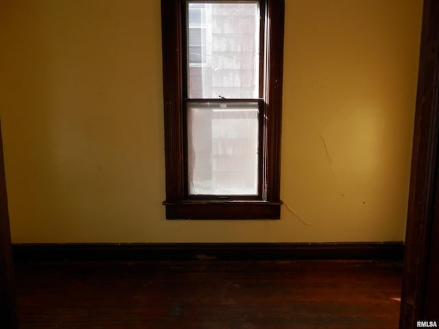 spare room featuring baseboards