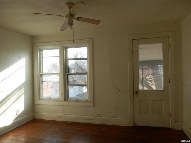 unfurnished room with a ceiling fan and wood finished floors