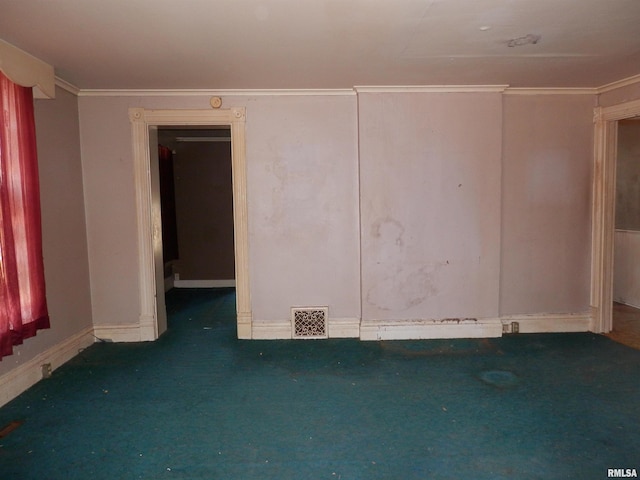 unfurnished room with visible vents, carpet flooring, baseboards, and ornamental molding