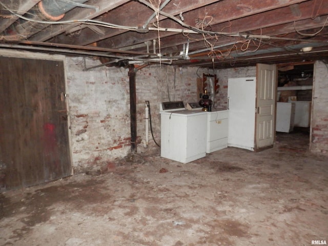 unfinished below grade area with independent washer and dryer