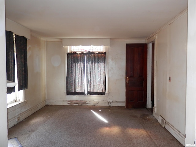 spare room with crown molding